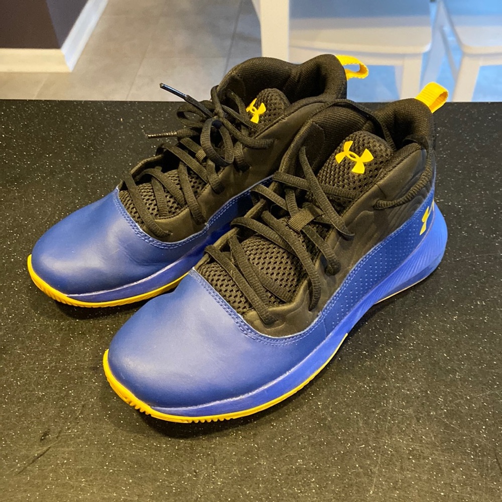Blue Under Armour basketball shoes.